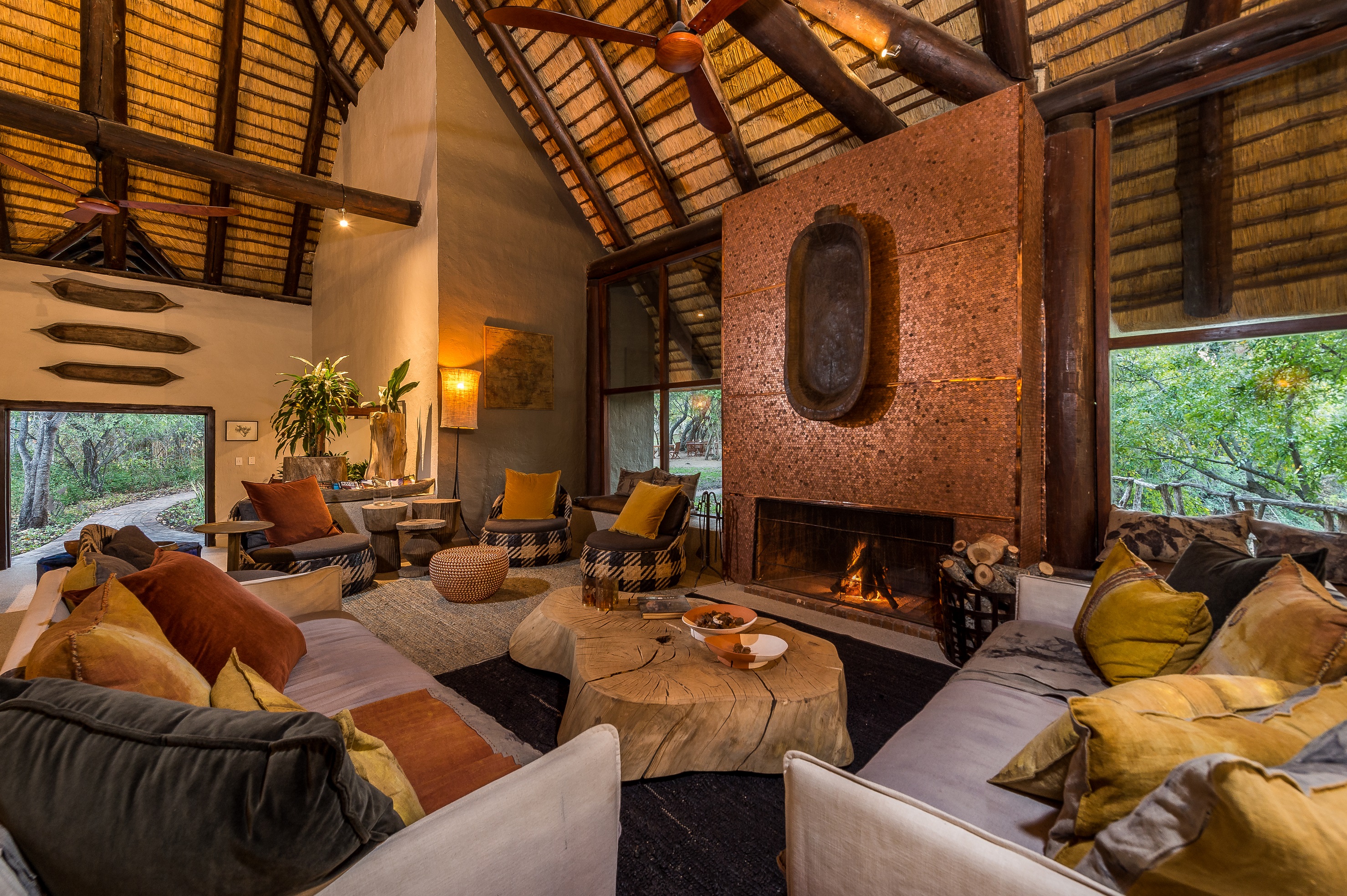 <p>The living area is open-air and features a thatched roof and wooden decking, allowing guests to feel connected to the natural environment while still enjoying the comforts of a modern safari lodge.</p>